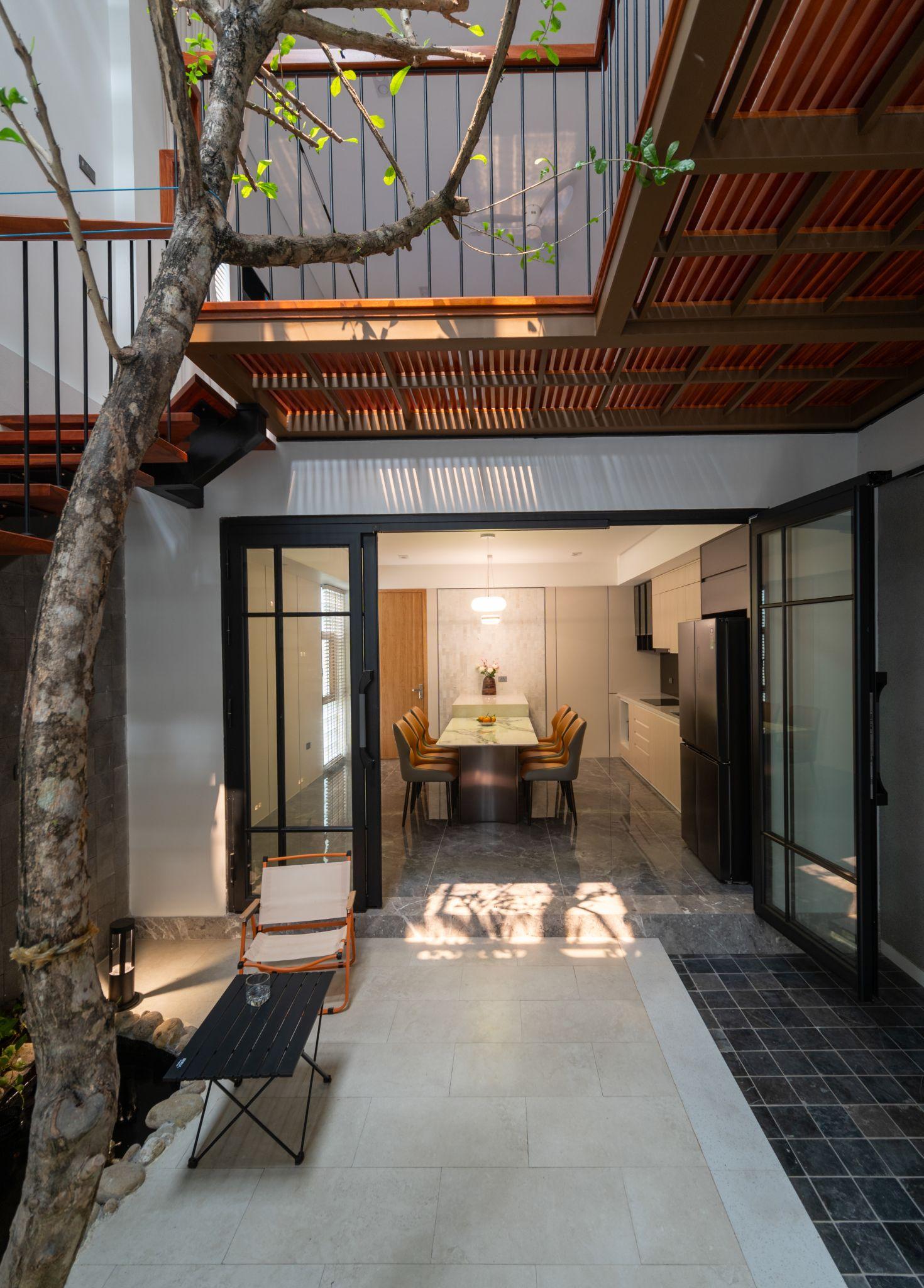 nha-thanh-ha-nha-pho-voi-loi-canh-quan-xanh-tmta-architecture_2.jpg